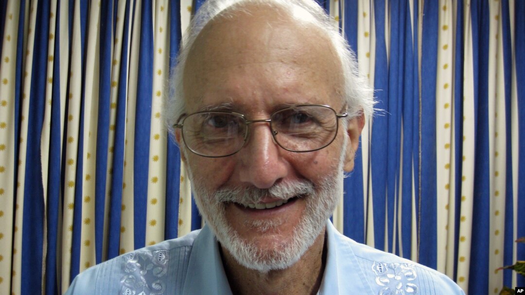 FILE - This Nov. 27, 2012 file photo provided by James L. Berenthal, shows jailed American Alan Gross during a visit by Rabbi Elie Abadie and U.S. lawyer James L. Berenthal at Finlay military hospital as he serves a prison sentence in Havana, Cuba.