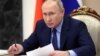 Russian President Vladimir Putin chairs a meeting on the situation of coal mining enterprises in Kuzbass, via teleconference call, at the Kremlin in Moscow, on Dec. 2, 2021. (Photo by Mikhail Metzel / SPUTNIK / AFP)