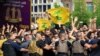 Lebanese army try to block supporters of the Lebanese Shi'ite groups Hezbollah and Amal as they gesture and chant slogans against anti-government demonstrators, in Beirut, June 6, 2020.
