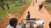 Supporters of the opposition leader Robert Kyagulanyi, also known as Bobi Wine, are blocked by police officers at checkpoint on a street leading to Kyagulanyi's house, as they bring food to deliver in Magere, Uganda, Jan. 21, 2021.