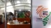 FILE - A woman looks on behind a stand during the 18th African Growth and Opportunity Act (AGOA) forum, in Abidjan, Ivory Coast, Aug. 5, 2019. 