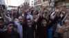 Shi'ite Muslim men shout slogans during a protest rally organised by the religious group Majlis-e- Wahdat-e-Muslimeen (MWM) in Karachi, January 11, 2013, to condemn the bomb blasts in Quetta a day earlier, and the killings of Shiites. 
