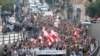 Demonstrators walk on the street during a protest in Beirut, Lebanon, Oct. 31, 2019. 