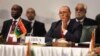 Libyan Foreign Minister Mohamed Abdelaziz, second left, attends a Cairo gathering of foreign ministers of Libya's neighbors in Cairo, Aug. 25, 2014. 