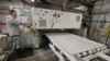 A worker begins production of a kitchen countertop that is being cut from imported quartz slabs from China in the production facility at Marble Uniques in Tipton, Ind., Friday, May 3, 2019. 