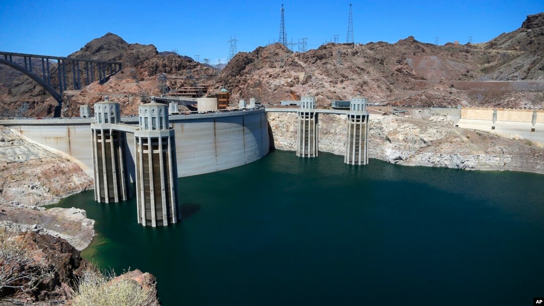 FILE - The low level of the water line is shown on the banks of the Colorado River at the Hoover Dam in Hoover Dam, Arizona, May 31, 2018.