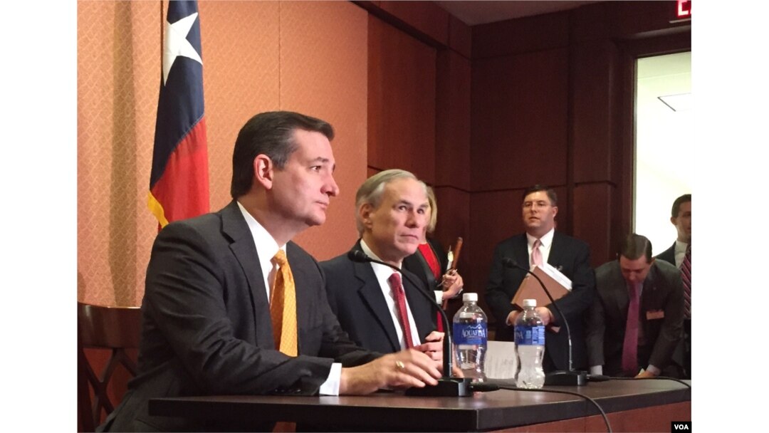FILE - Republican presidential candidate Sen. Ted Cruz, R-Texas, left, and Texas Gov. Greg Abbott, speak about the resettlement of Syrian refugees in the U.S., during their joint news conference on Capitol Hill in Washington, Dec. 8, 2015 (VOA/ M. Bowman).