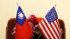 FILE - Flags of Taiwan and the United States are placed on a table before a meeting between Taiwanese and American lawmakers, in Taipei, Taiwan, March 27, 2018.