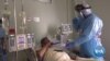 Biden Rolls Out Pandemic Strategy, Joins Global Effort