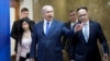 FILE - Israeli Prime Minister Benjamin Netanyahu, center, arrives to attend the weekly Cabinet meeting in Jerusalem, March 17, 2019. 