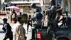 Afghan policemen arrive after a suicide bomber wearing a military uniform struck the entrance gate of the Interior Ministry compound in Kabul, Afghanistan, April 2, 2014. 