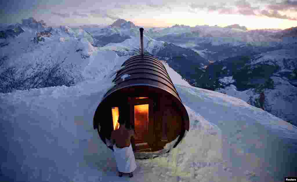 A person enter in sauna on the peak of Mount Lagazuoi in Cortina D'Ampezzo, Italy, Jan. 16, 2018.