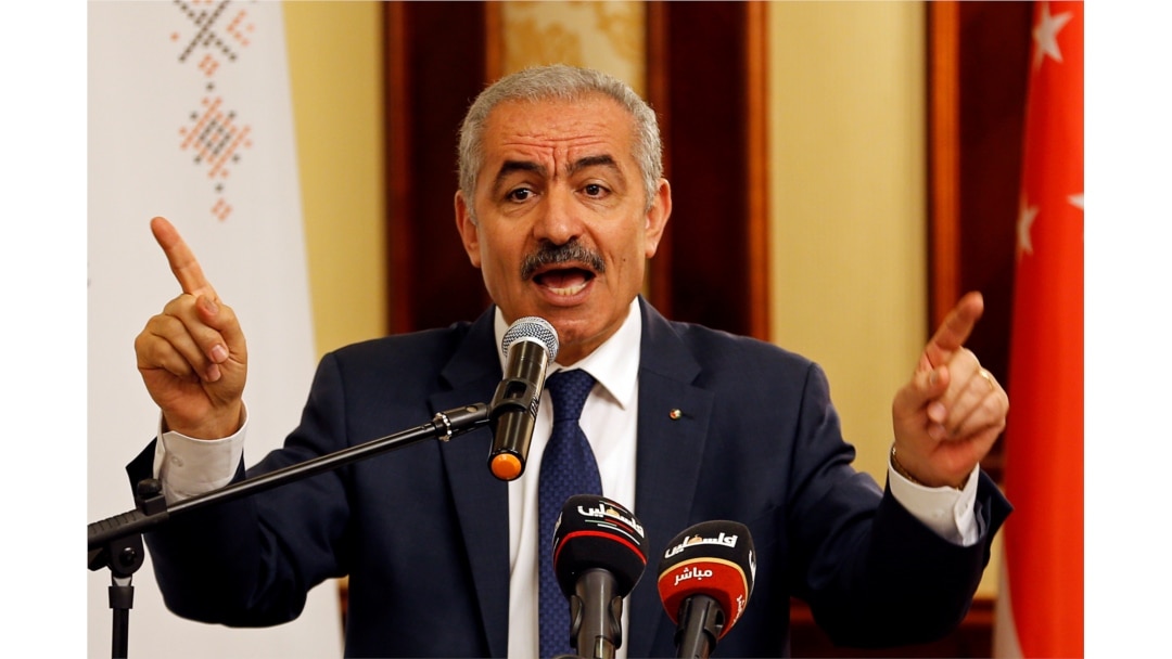 FILE - Palestinian Prime Minister Mohammad Shtayyeh gestures as he speaks during a workshop on cooperation between Palestinians and East Asian countries, in Jericho in the Israeli-occupied West Bank July 3, 2019.