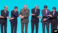 ASEAN, defense ministers and dialogue nations defenses ministers pose for a group photo during ASEAN defense ministers and dialogue countries meeting on Monday, Nov. 18, 2019, Bangkok, Thailand.
