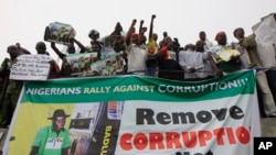 FILE - People protest following the removal of fuel subsidy by the government in Lagos, Nigeria, Jan. 9, 2012.
