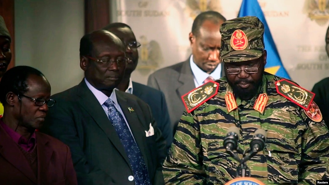 FILE - South Sudan's President Salva Kiir, right, addresses news conference at Presidential Palace, Juba, Dec. 16, 2013.
