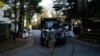 Secret Service personnel park vehicles in the driveway leading to President Joe Biden's home after classified documents were reportedly found there, in Wilmington, Delaware, Jan. 15, 2023. 