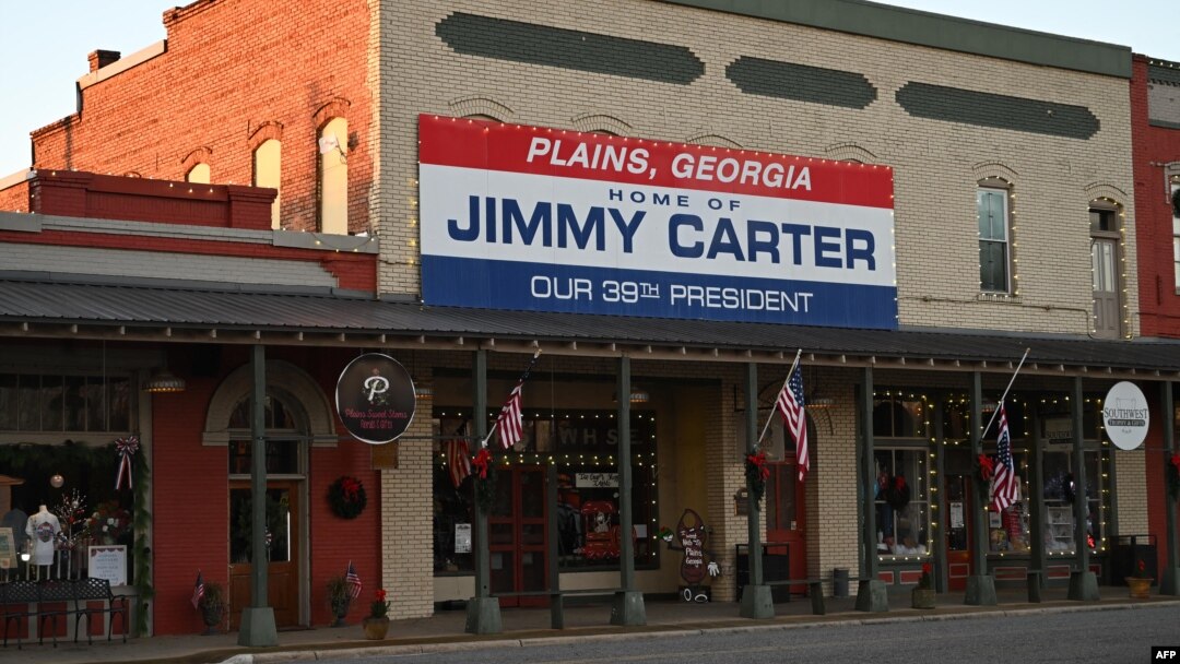 A sign in honor of former U.S. President Jimmy Carter hangs in Plains, Georgia, on Dec. 30, 2024.