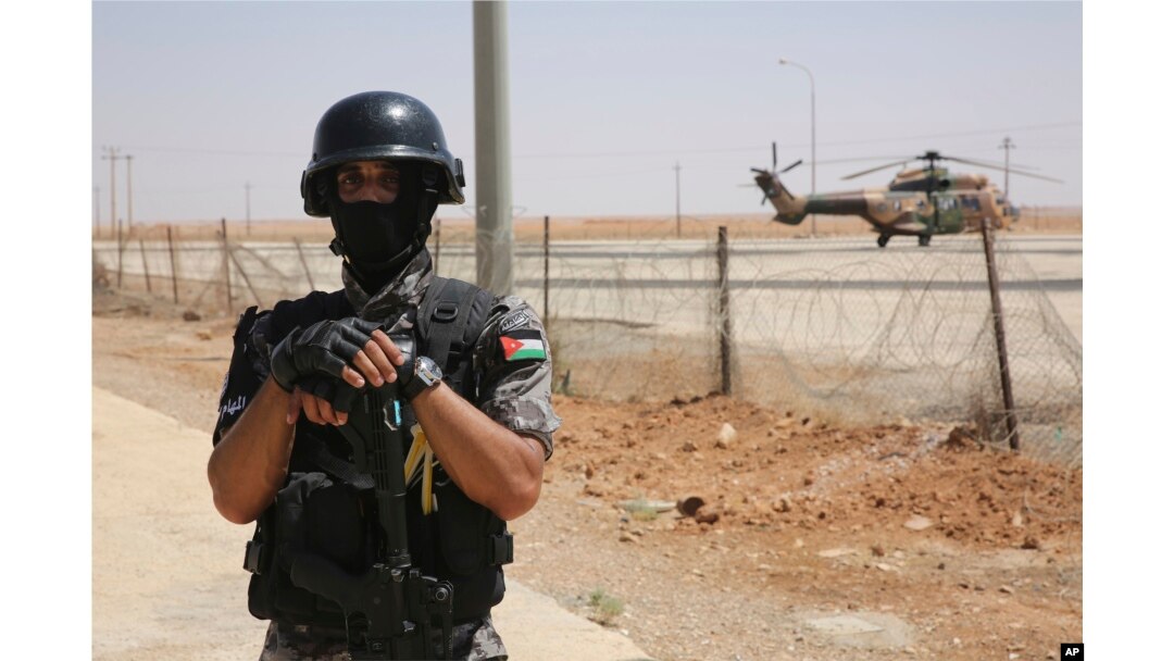 A Jordanian soldier stands guard at the Iraq-Jordan border, Aug. 30, 2017, at the Jordanian Karameh border crossing.