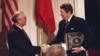 FILE - U.S. President Ronald Reagan, right, shakes hands with Soviet leader Mikhail Gorbachev after the two leaders signed the Intermediate Range Nuclear Forces Treaty, Dec. 8, 1987.