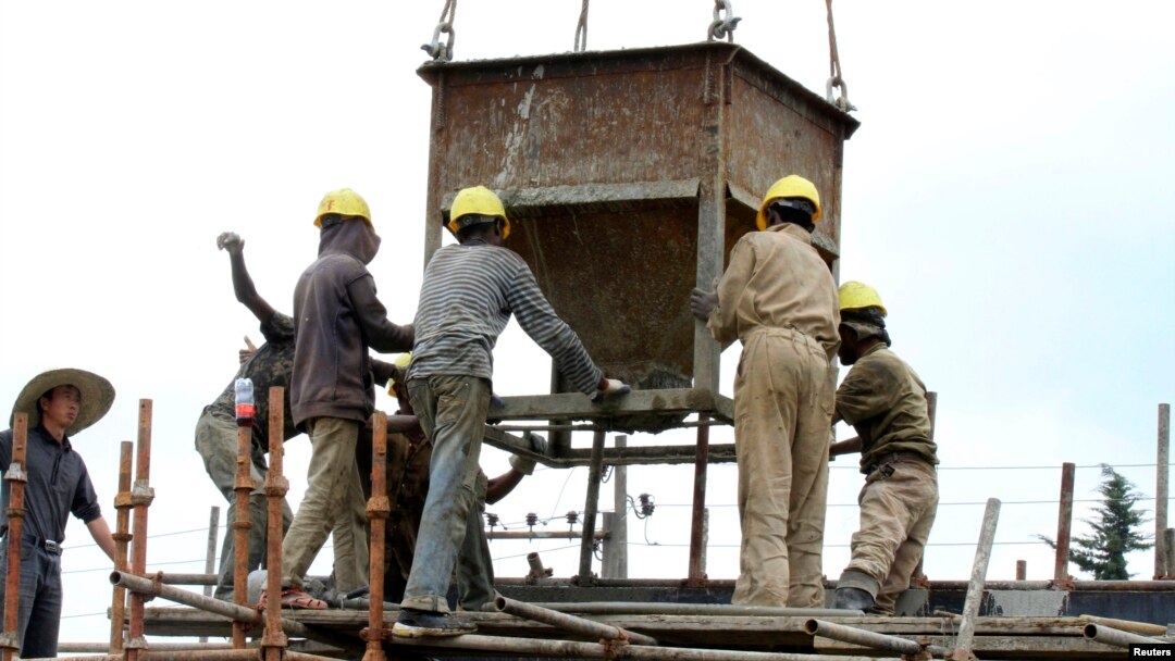 Laborers work at a railway station construction site in Ethiopia's capital Addis Ababa, Sept. 16, 2013.