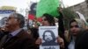 Human rights activists hold a picture of Salman Haider, who is missing, during a protest to condemn the disappearances of social activists in Karachi, Pakistan, Jan. 19, 2017.