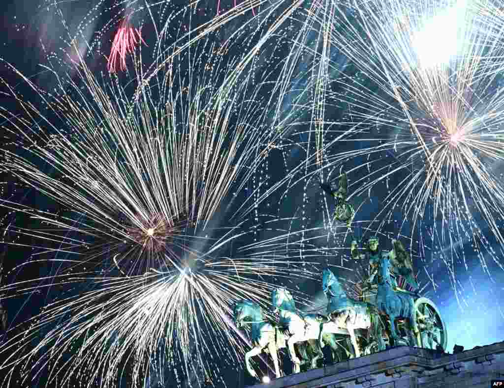 Fireworks illuminate the Quadriga atop the Brandenburg Gate during the New Year celebrations in Berlin, Jan. 1, 2025.
