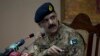 FILE - Pakistan's army spokesman Major-General Asim Bajwa briefs the media about a Taliban attack on a school in Peshawar, Pakistan, Dec. 16, 2014.