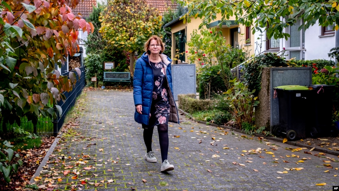 Claudia Huth walks in front of her house in Egelsbach, Germany, Oct. 31, 2024.