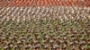 FILE - Members of Iran's Revolutionary Guard march in front of the mausoleum of the late revolutionary founder Ayatollah Khomeini outside Tehran, Sept. 2014.