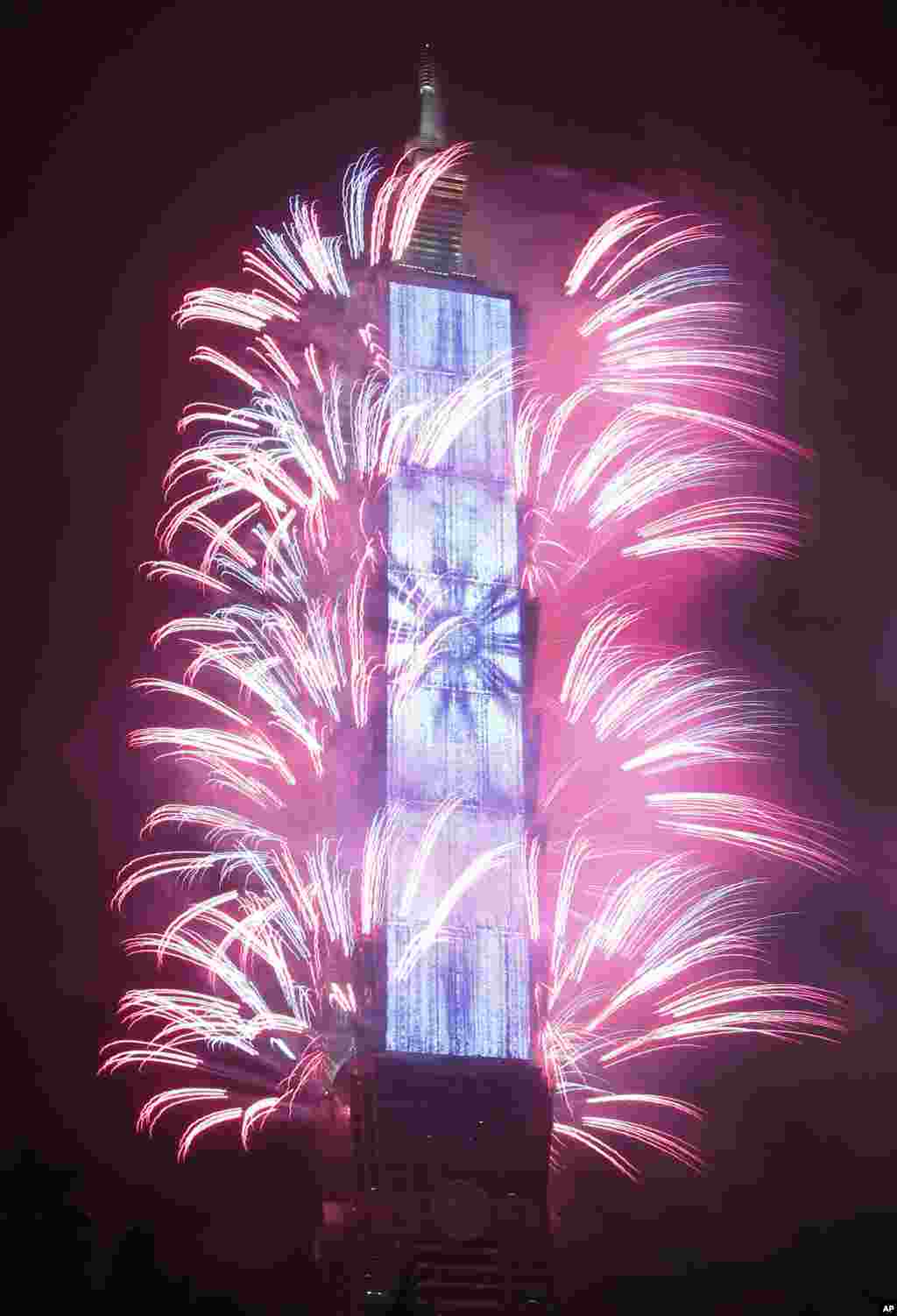 Fireworks explode from the Taipei 101 building during the New Year's celebrations in Taipei, Taiwan.