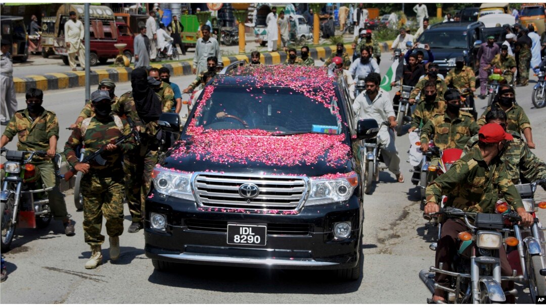 A vehicle carrying Syed Salahuddin, the top leader of the Hizbul Mujahideen, is escorted by his supporters, arrives for a press conference in Muzaffarabad, the capital of Pakistani controlled Kashmir, Saturday, July 1, 2017.