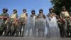 Egyptian soldiers stand guard near the Republican Guard headquarters, Cairo, July 19, 2013.