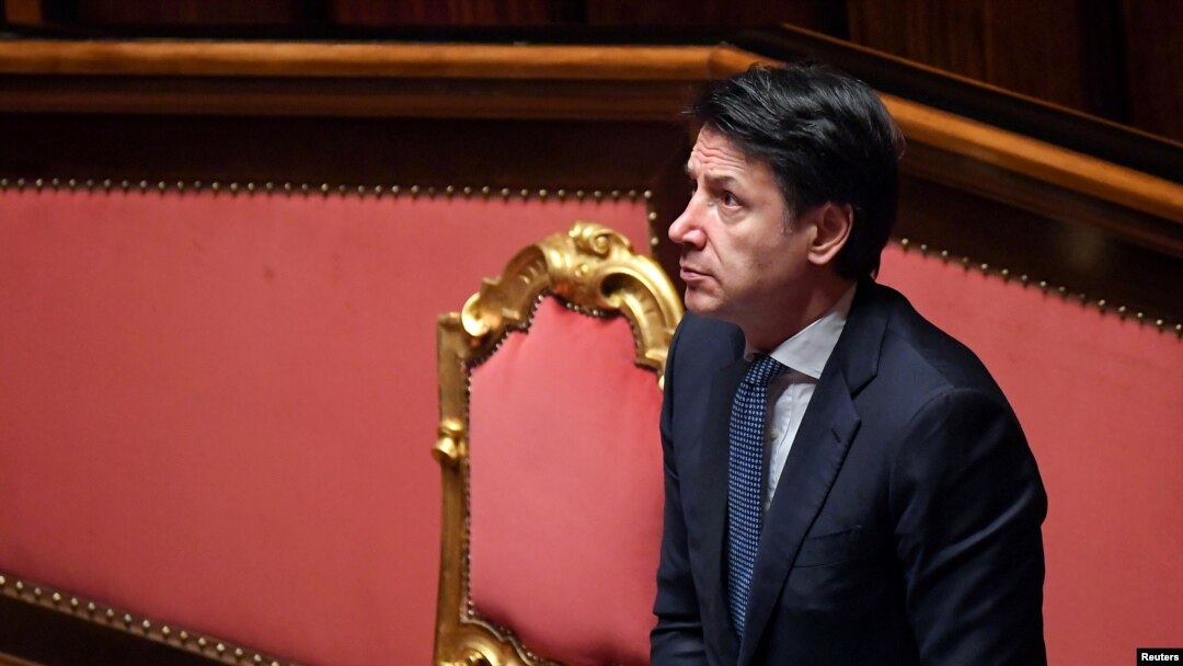 FILE - Italian Prime Minister Giuseppe Conte stands during a session in the Senate, the upper house of parliament, on the spread of coronavirus, in Rome, Italy, March 26, 2020.