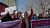 FILE - Afghan women shout slogans during a rally to protest Taliban restrictions on women, in Kabul, Afghanistan, Dec. 28, 2021.