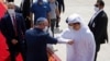 Israeli National Security Advisor Meir Ben-Shabbat, center left, elbow bumps with an Emirati official as he leaves Abu Dhabi, Arab Emirates, Sept. 1, 2020.