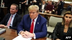 Former US President Donald Trump sits in New York State Supreme Court during the civil fraud trial against the Trump Organization, in New York City on January 11, 2024.