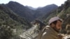 FILE - A soldier patrols the White Mountains near Tora Bora, Afghanistan, Dec. 18, 2001. 