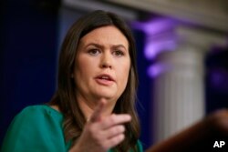 White House press secretary Sarah Huckabee Sanders talks to reporters during a press briefing at the White House in Washington, Oct. 29, 2018.