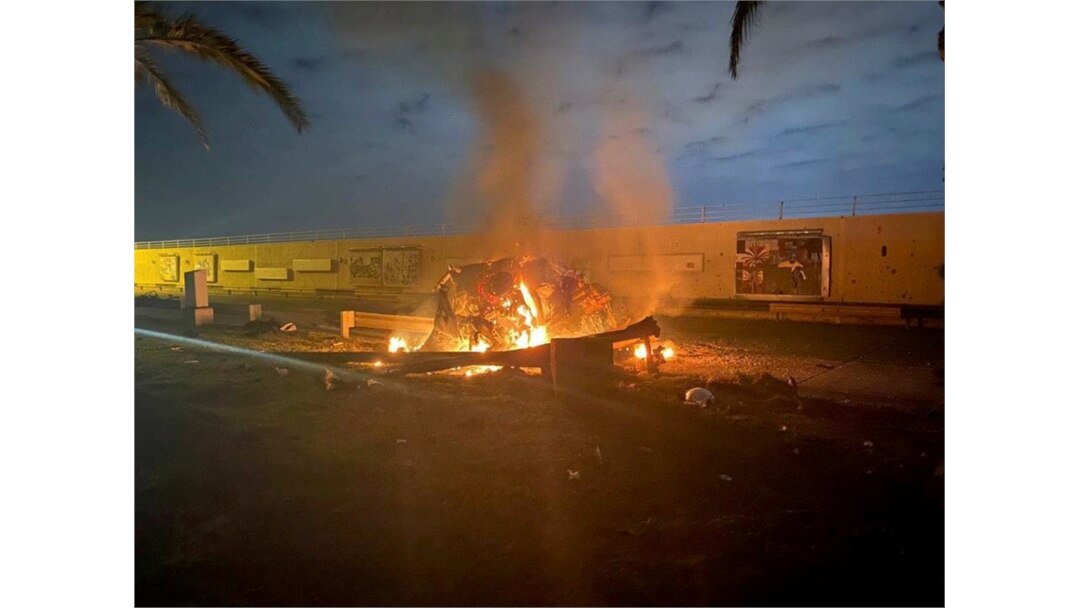 Burning debris are seen on a road near Baghdad International Airport, which according to Iraqi paramilitary groups were caused by three rockets hitting the airport in Iraq, January 3, 2020.