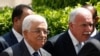 FILE - Palestinian President Mahmoud Abbas and his foreign minister Riyad al-Maliki (R) arrive for an Arab League Foreign Ministers emergency meeting at the league's headquarters in Cairo, Sept. 7, 2014.