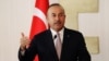 Turkey's Foreign Minister Mevlut Cavusoglu talks at a news conference during a visit in the Turkish Cypriot northern part of the divided city of Nicosia, Cyprus, July 24, 2018.