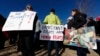 Supporters hold up a placard during a rally in for Jeanette Vizguerra, a Mexican woman seeking to avoid deportation from the United States, outside the Immigration and Customs Enforcement office in Centennial, Colo. 