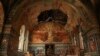 Ukrainian serviceman Gennadiy Yudin stands inside orthodox church damaged by a Russian bombing in Novoekonomichne, Ukraine, Sept. 17, 2024. 