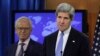 U.S. Secretary of State John Kerry (R) speaks next to Martin Indyk at the State Department in Washington, July 29, 2013.