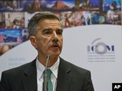 FILE - U.S. Deputy Assistant Secretary of State for Educational and Cultural Affairs Mark Taplin speaks to the media during a media conference in Paris, Dec. 15, 2015.