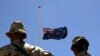 FILE - Australian troops stand at attention during a ceremony at Camp Armadillo in Afghanistan's in Helmand province, April 25, 2008. 