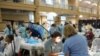 Many of the people at the free clinic have health insurance through their jobs but the plans don't pay for extras like dental and vision care.