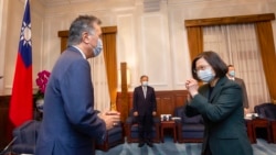 In this photo released by the Taiwan Presidential Office, U.S. Representative Mark Takano, D-Calif. left is greeted by Taiwanese President Tsai Ing-wen at the Presidential Office in Taipei, Taiwan on Friday, Nov. 26, 2021.