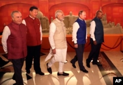Leaders of BRICS nations (L-R) Brazilian President Michel Temer, Chinese President Xi Jinping, Indian Prime Minister Narendra Modi, Russian President Vladimir Putin and South African President Jacob Zuma walk at their summit in Goa, India, Oct. 15, 2016.